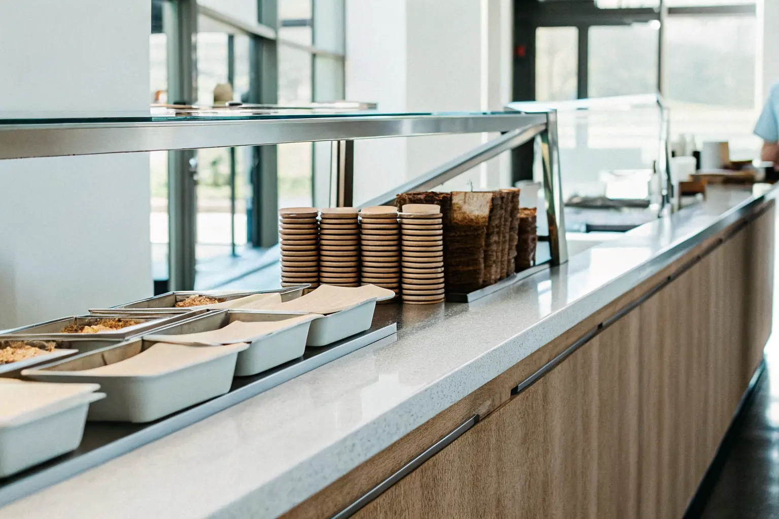 Hospital cafeteria and nutrition service counter with compostable trays and containers for a hospital sustainability program