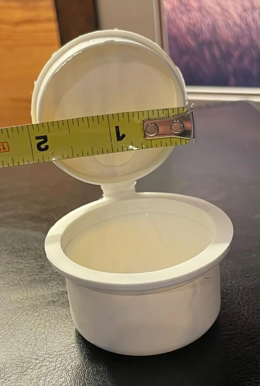 Close-up of the hinged lid on a PHA pop top container