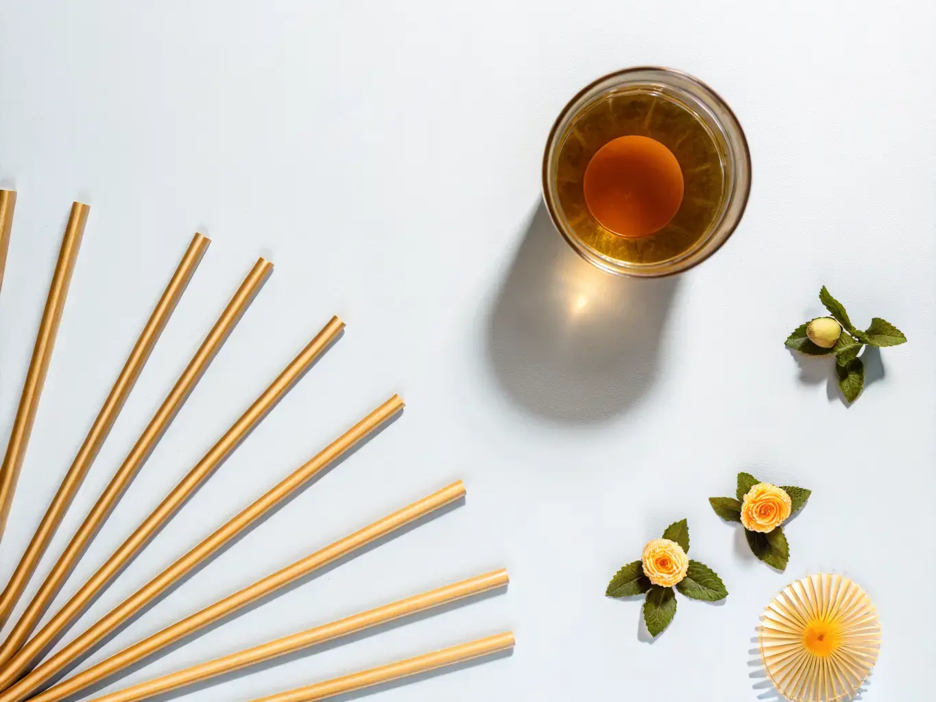 Biodegradable PHA straws arranged in an eco-friendly flat lay
